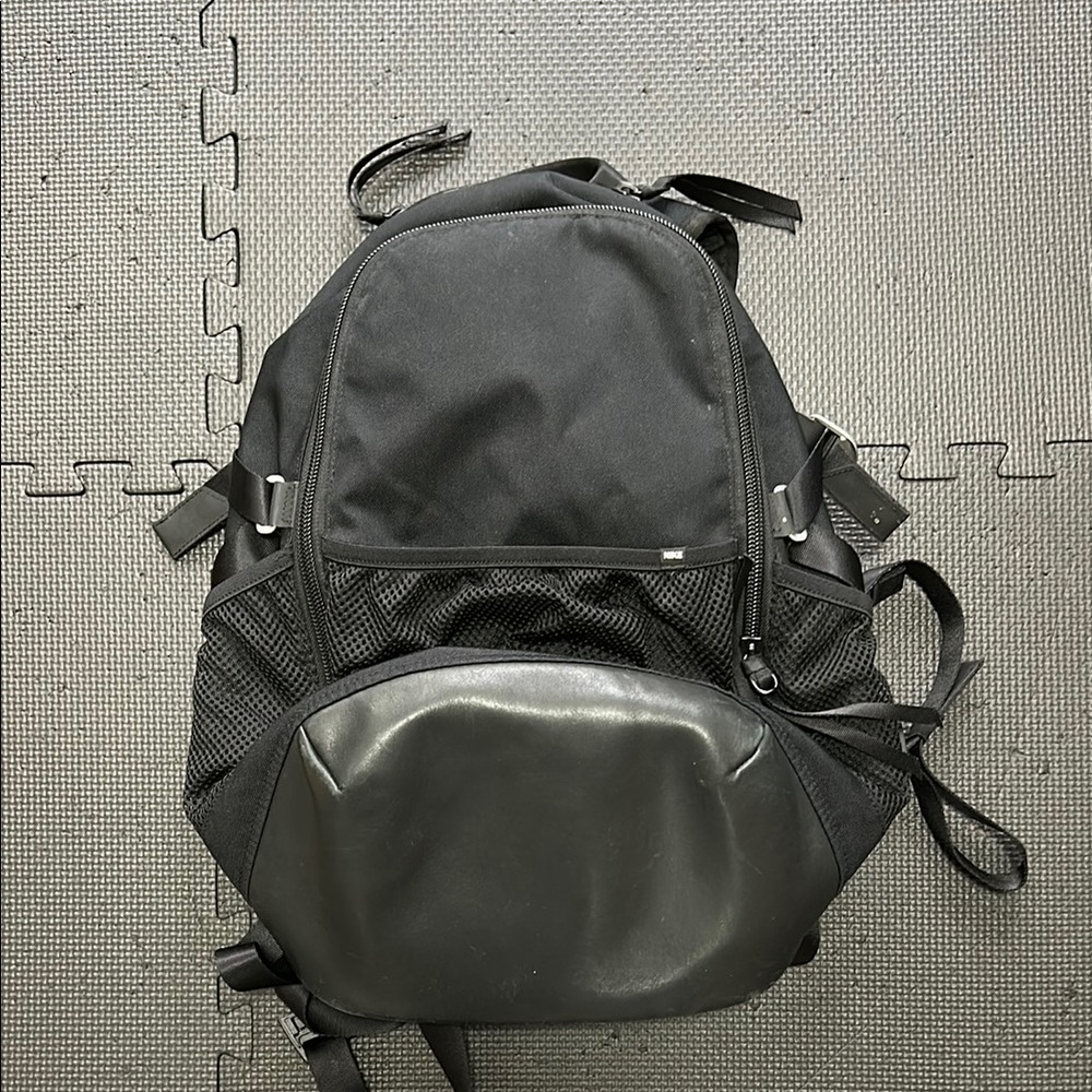 Black Backpack with Durable Fabric and Rounded Shape